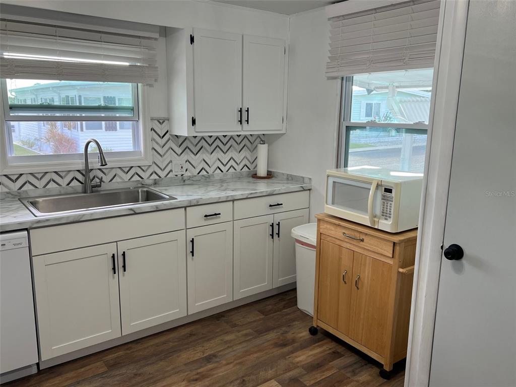 576 Queen Palm Largo, FL 33778 - Photo 6 of 33 a kitchen with appliances cabinets and a sink