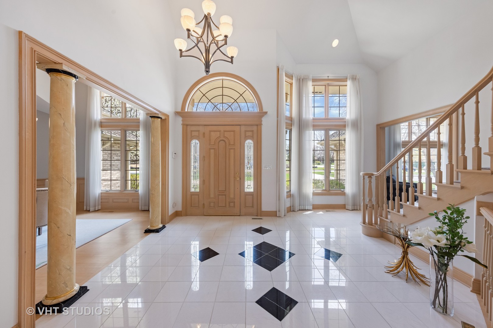 101 Windmill Road Orland Park, IL 60467 - Photo 11 of 56 a view of an entryway with wooden floor and a rug