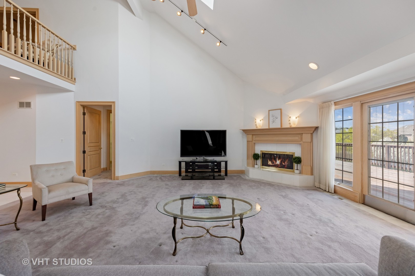 101 Windmill Road Orland Park, IL 60467 - Photo 14 of 56 a living room with furniture a fireplace and a flat screen tv