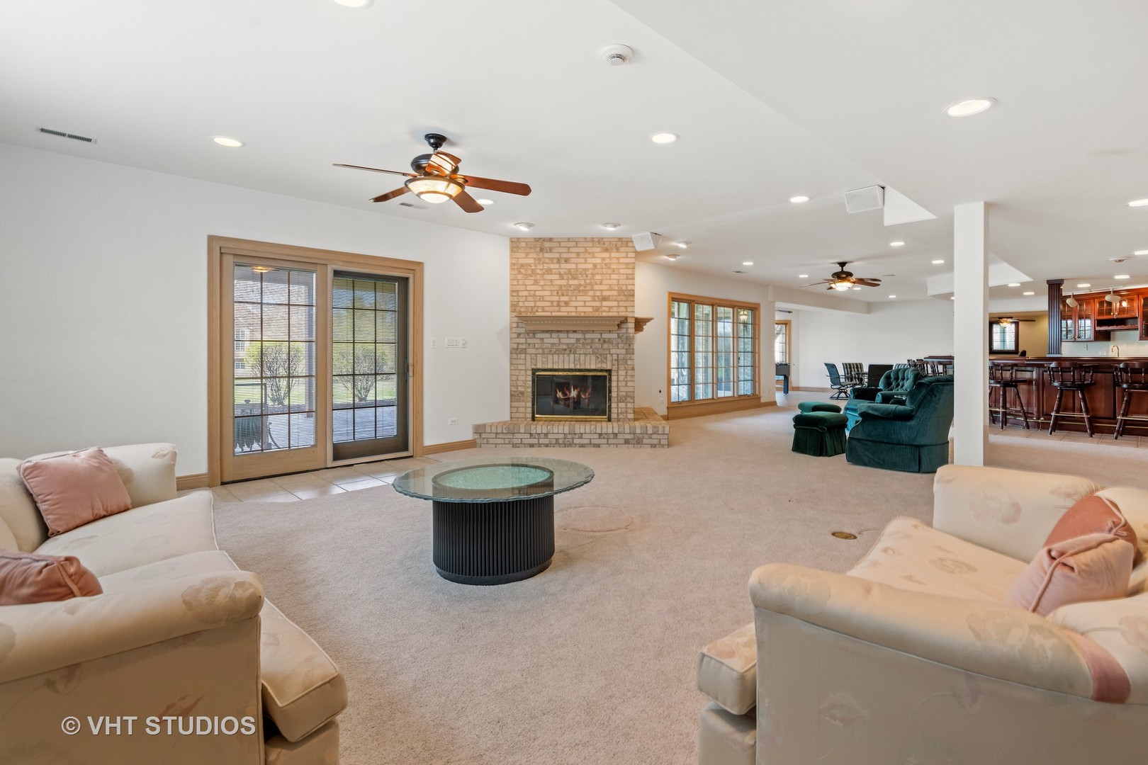 101 Windmill Road Orland Park, IL 60467 - Photo 37 of 56 a living room with furniture a fireplace and a chandelier