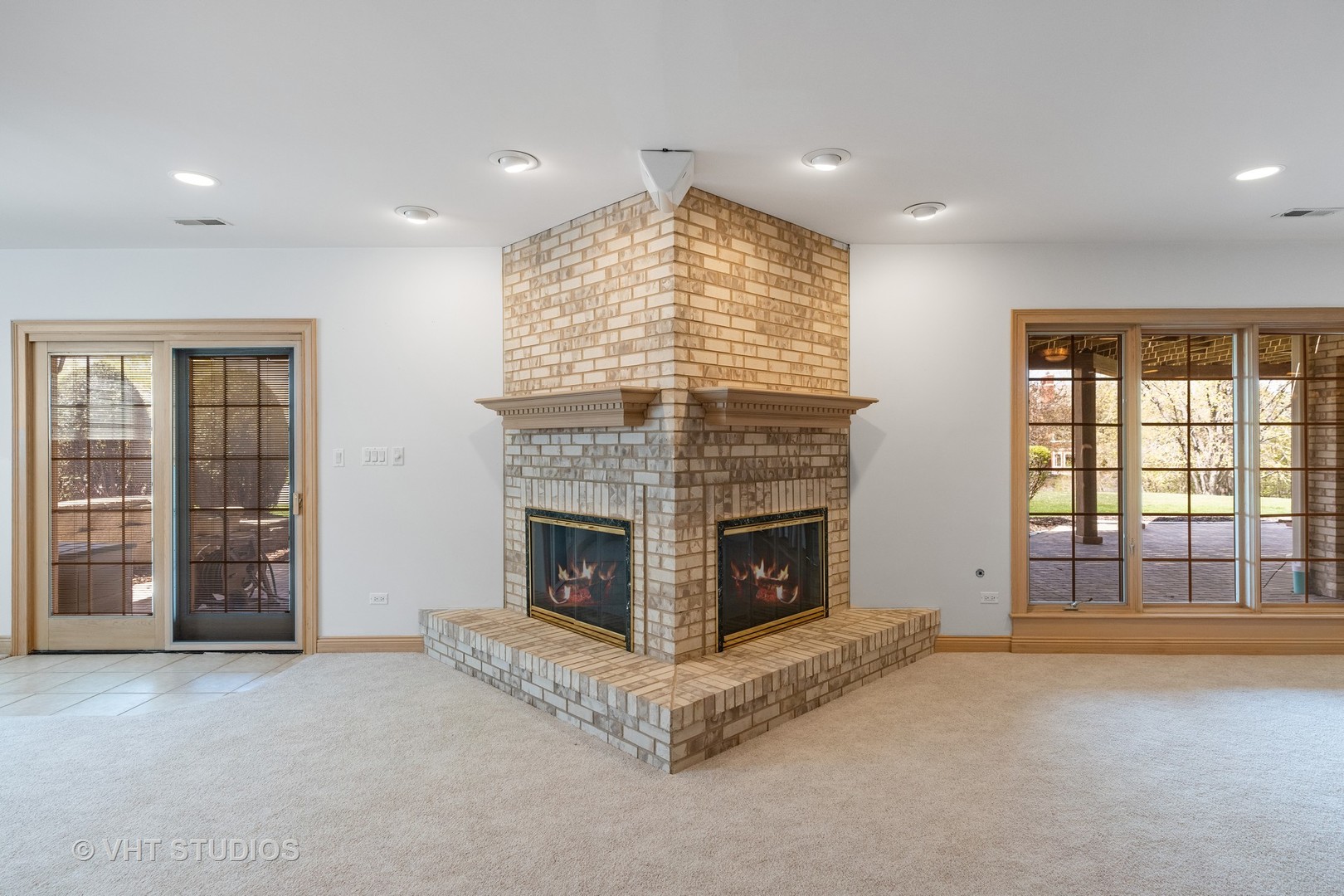 101 Windmill Road Orland Park, IL 60467 - Photo 42 of 56 a view of an empty room with a fireplace and a window