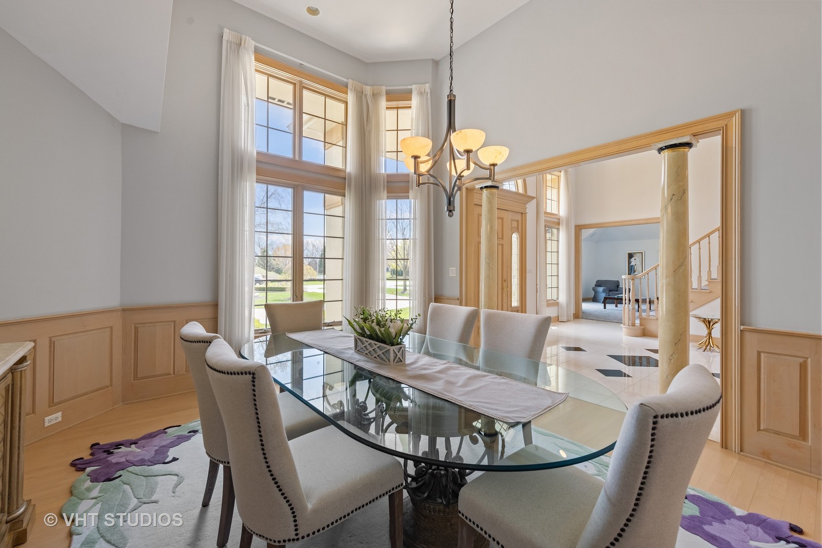 101 Windmill Road Orland Park, IL 60467 - Photo 9 of 56 a dining room with furniture a chandelier and wooden floor