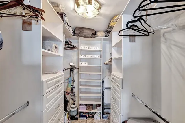 a bedroom with a bed a lamp and window