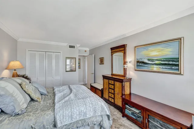 a bathroom with a granite countertop sink toilet a mirror a vanity and shower