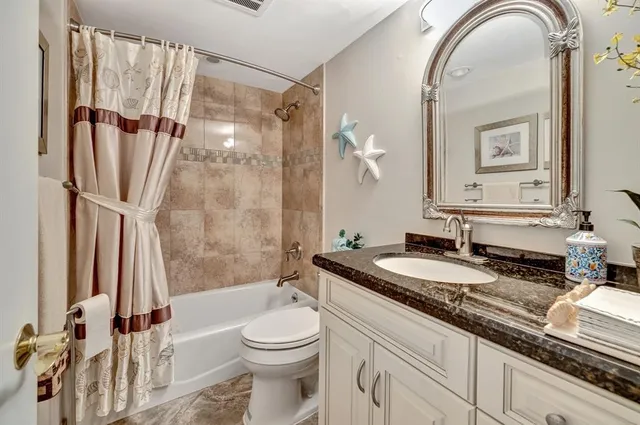 a view of a ocean with a nearby beach