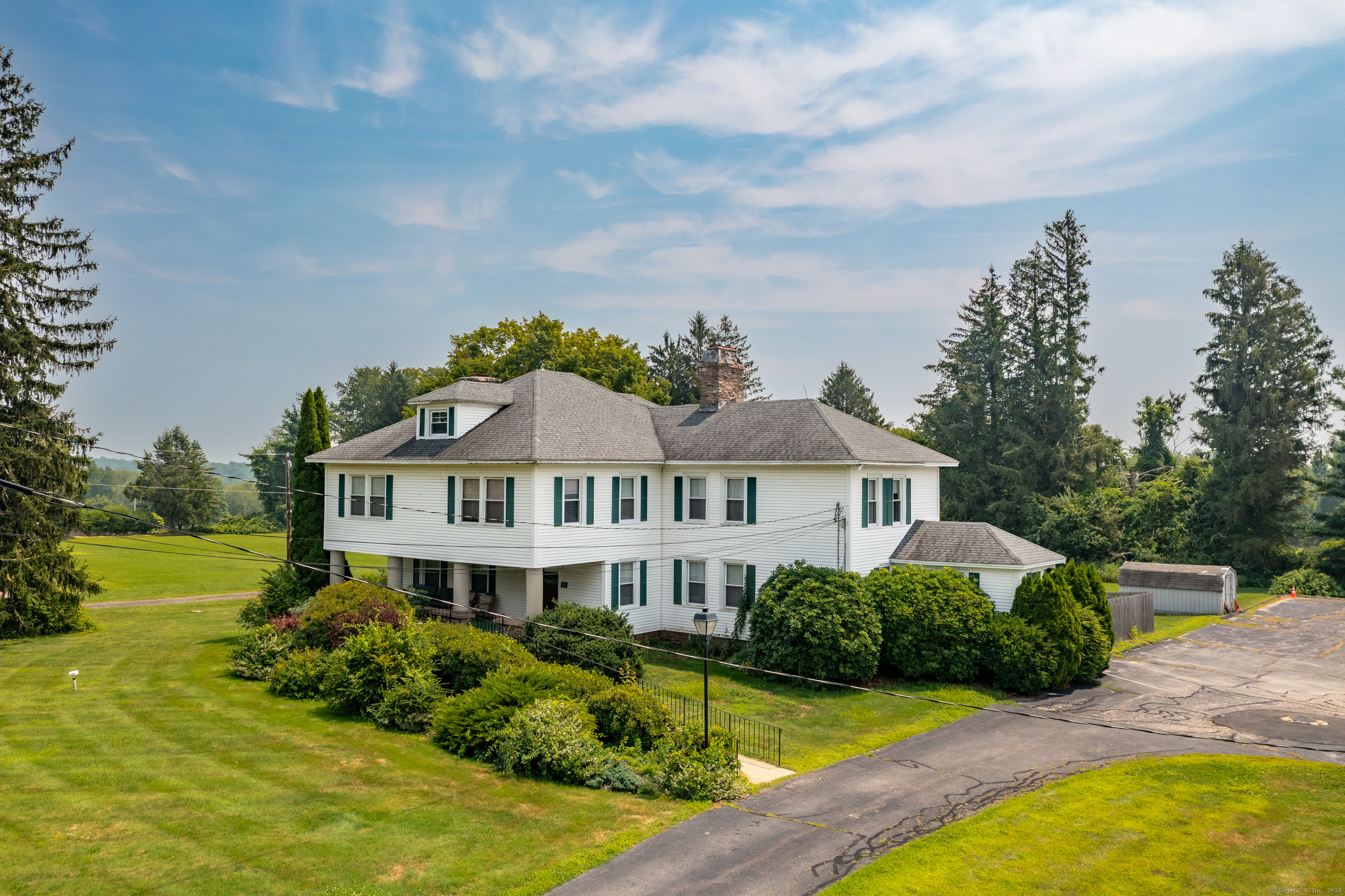 a front view of a house with a big yard