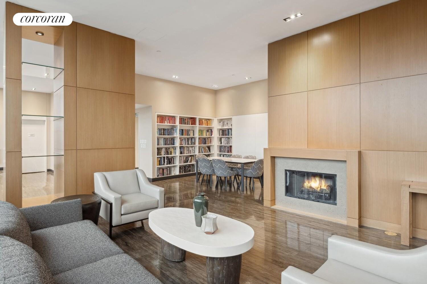 425 Main Street, Unit PH2E Manhattan, NY 10044 - Photo 9 of 22 a living room with furniture and a fireplace