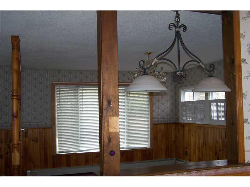 106 Taylor Road Pittsfield, ME 04967 - Photo 13 of 35 Living Room. View from kitchen to...