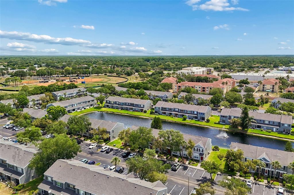 382 Countryside Key Boulevard Oldsmar, FL 34677 - Photo 46 of 58 an aerial view of a city with a lake view