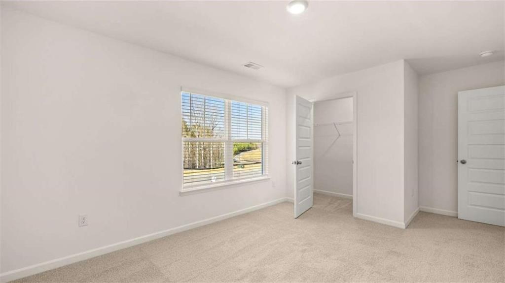 2262 Edgecombe Lane Dacula, GA 30019 - Photo 35 of 41 an empty room with windows