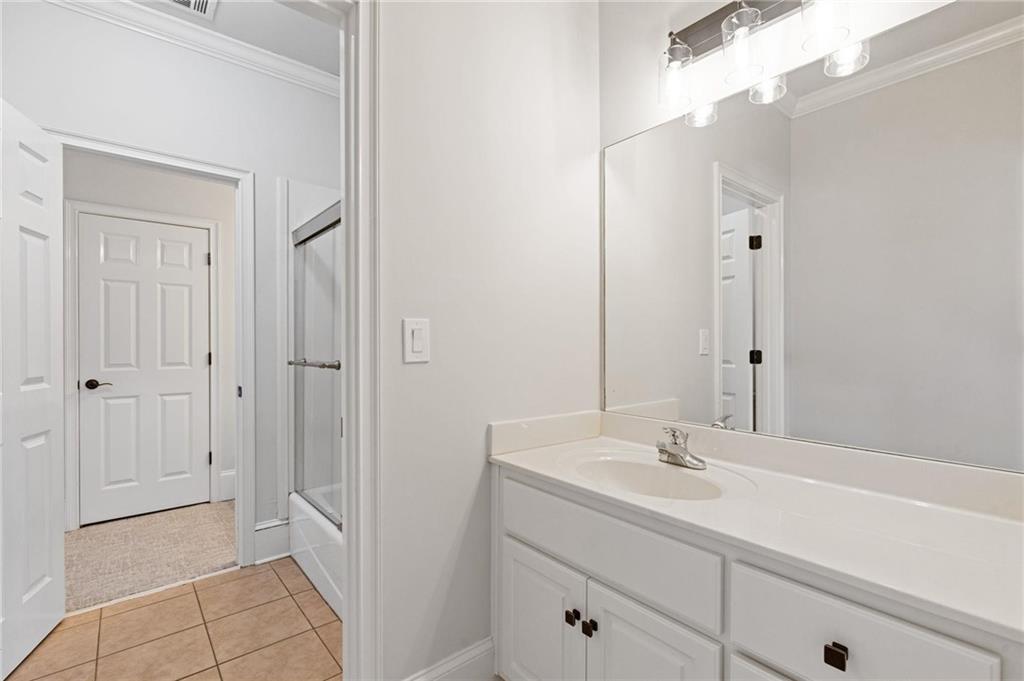 2010 Legends Way Braselton, GA 30517 - Photo 43 of 77 a bathroom with a sink and a mirror