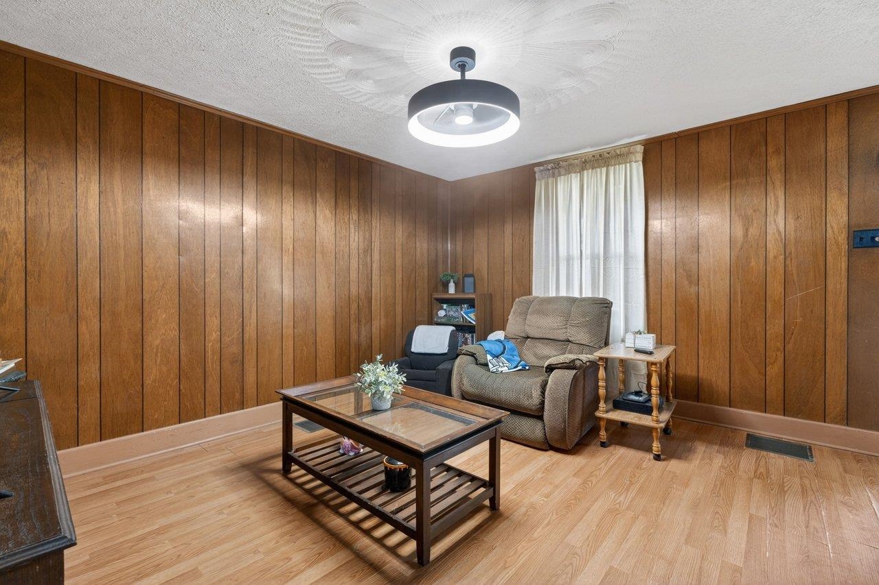 724 Newtown Road Elkton, VA 22827 - Photo 9 of 38 a living room with furniture and wooden floor