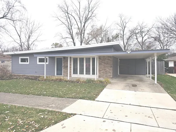 front view of a house with a yard