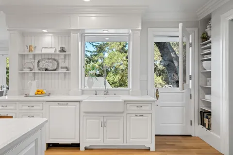 a bathroom with a sink toilet a mirror and tub