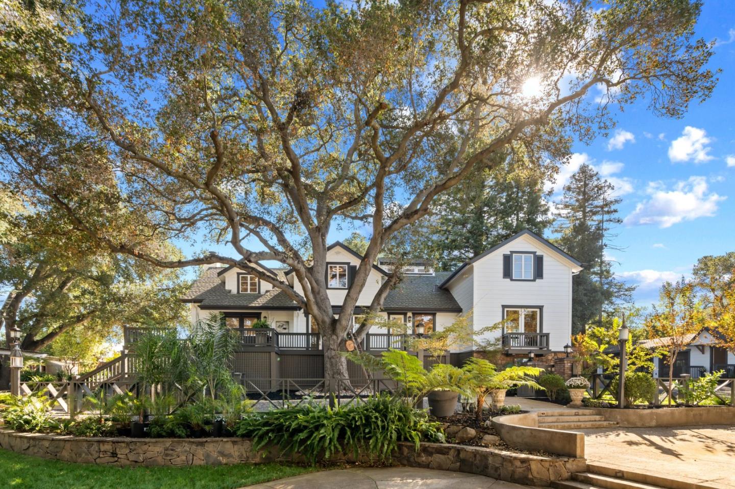 19050 Camino Barco Saratoga, CA 95070 - Photo 3 of 91 a front view of a house with a yard and tree s