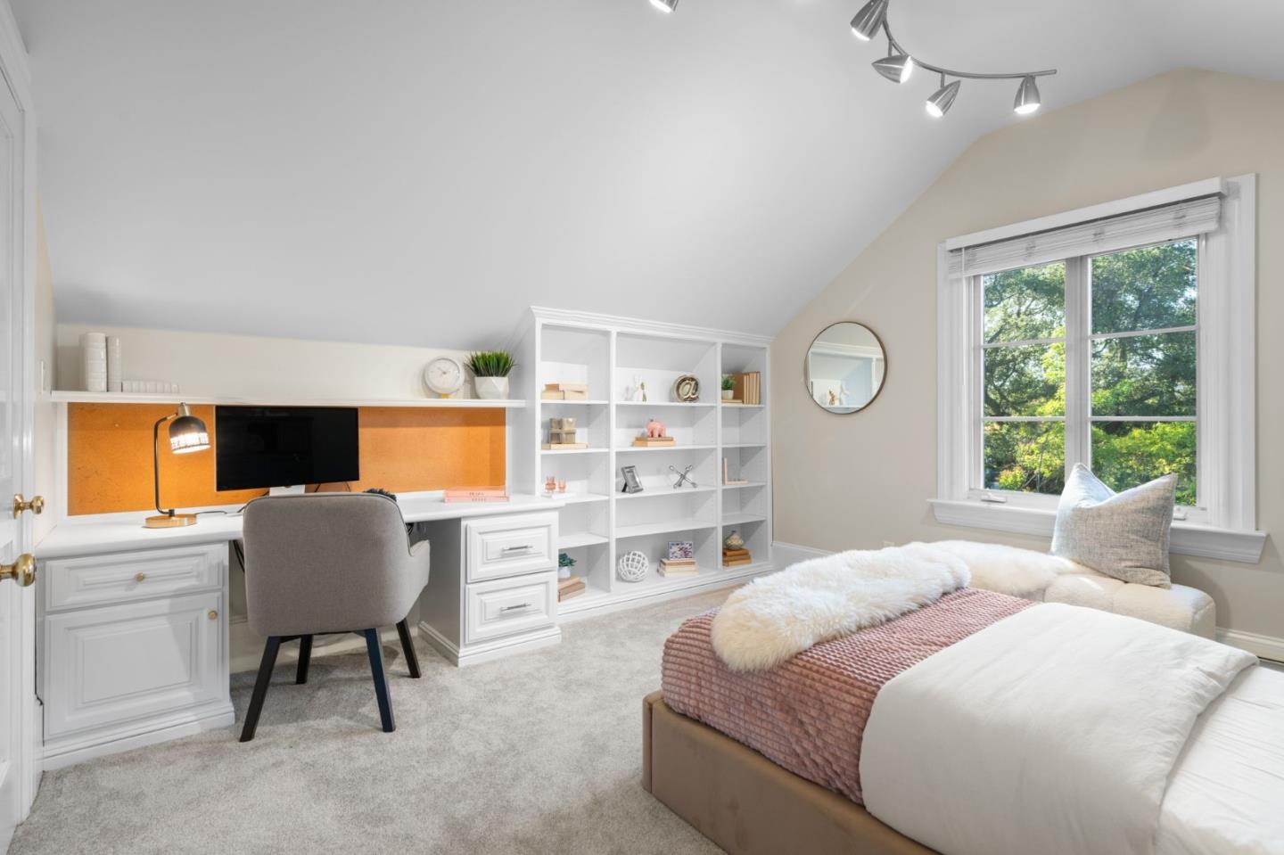 19050 Camino Barco Saratoga, CA 95070 - Photo 36 of 91 a bedroom with a bed and a chair with the bookshelf