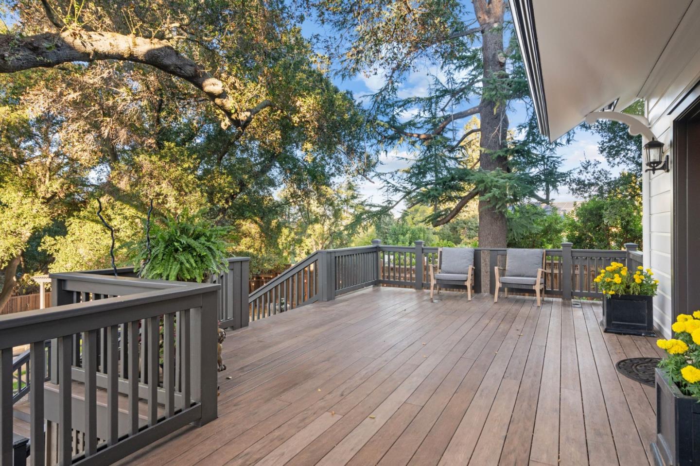 19050 Camino Barco Saratoga, CA 95070 - Photo 5 of 91 a view of a deck with chairs and table with wooden floor and fence