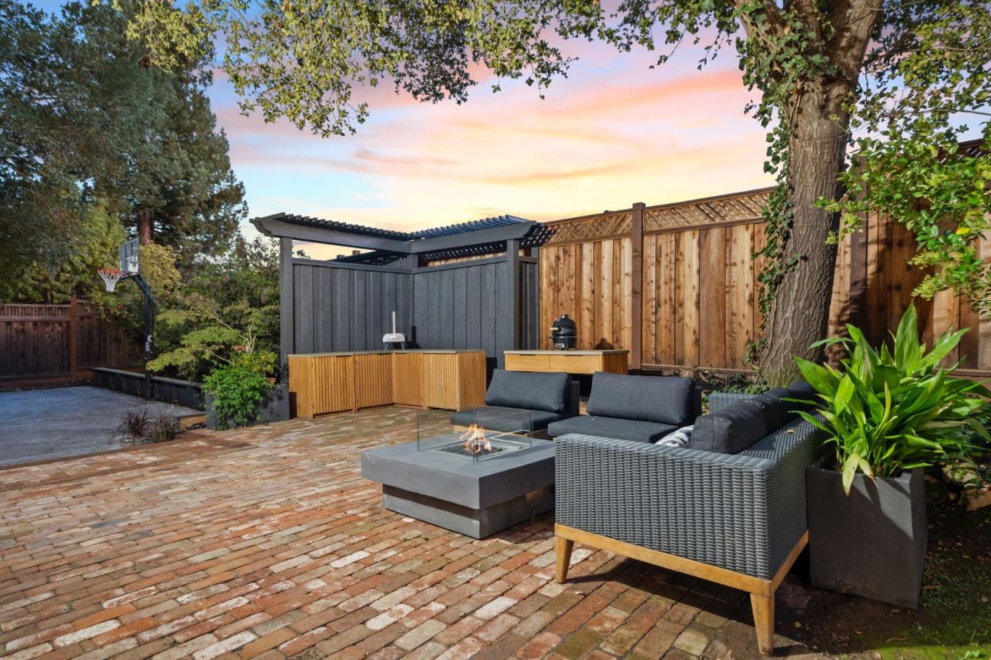 19050 Camino Barco Saratoga, CA 95070 - Photo 84 of 91 a view of a patio with couches and a table and chairs with wooden fence