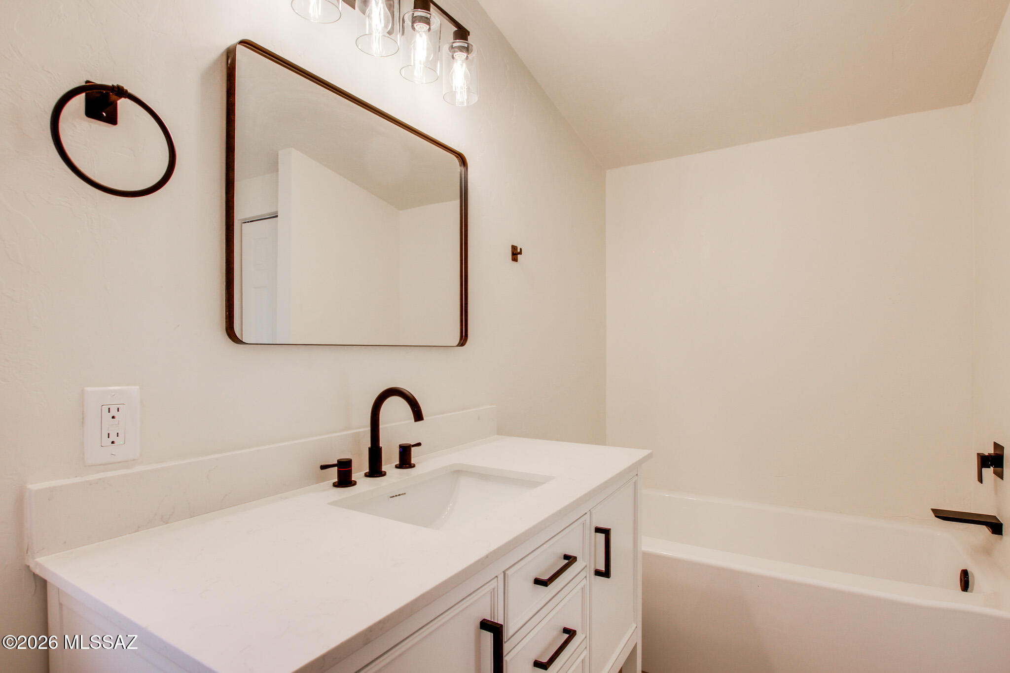 14303 West Rolina Lane Tucson, AZ 85736 - Photo 25 of 38 a bathroom with a sink vanity and mirror