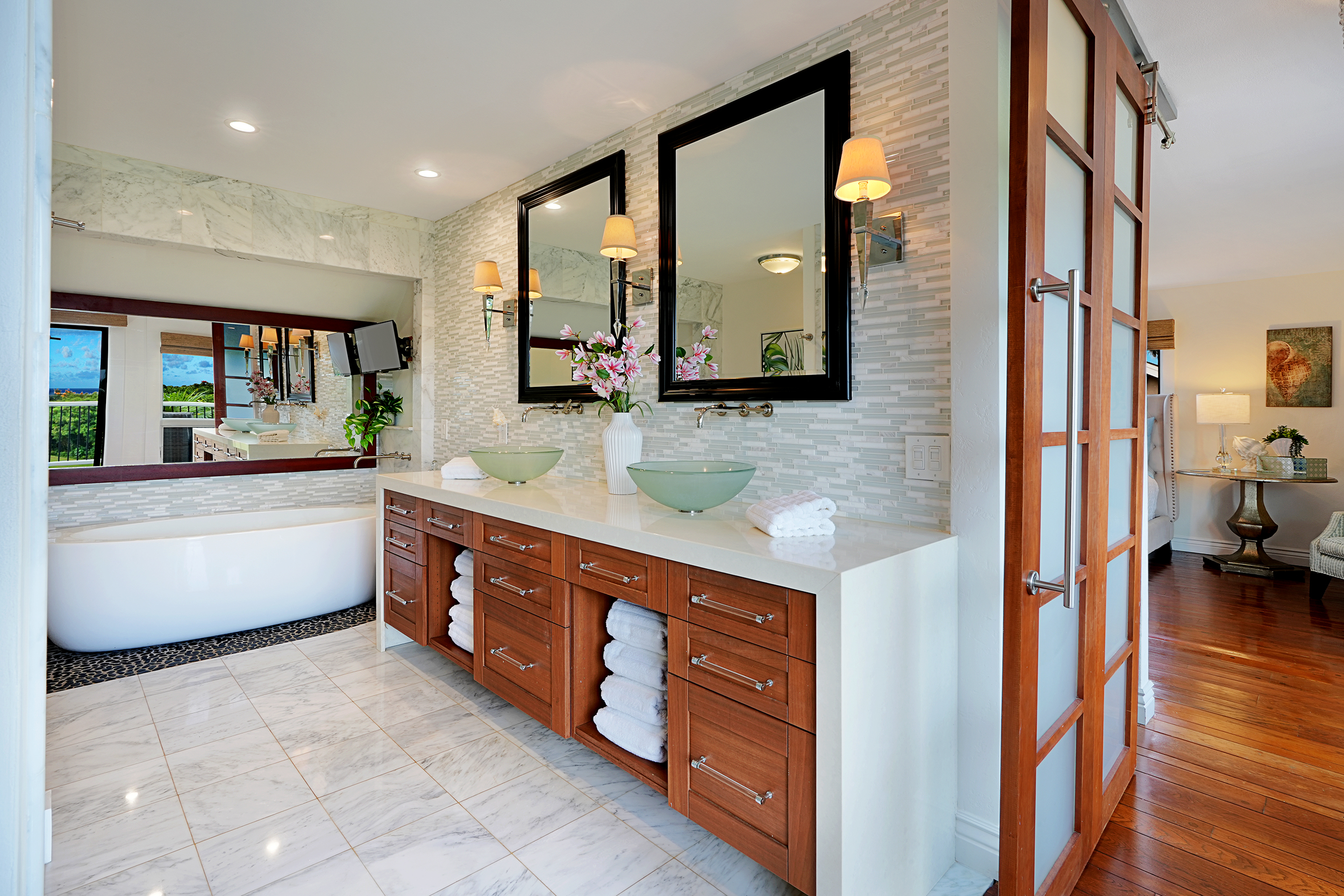 5348 Honoiki Road Princeville, HI 96722 - Photo 15 of 25 a large bathroom with a large tub and sink
