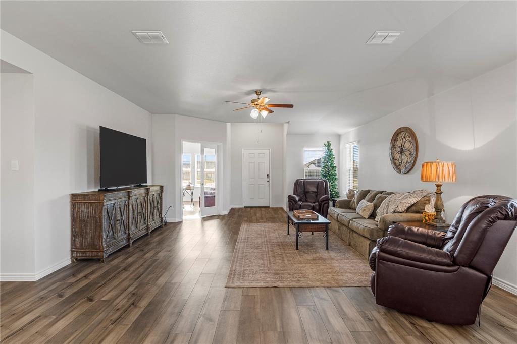 10761 Chesson Flts Drive Waco, TX 76708 - Photo 8 of 30 a living room with furniture and a flat screen tv