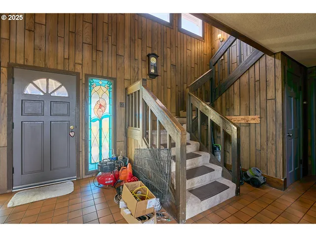 a view of entryway with wooden floor