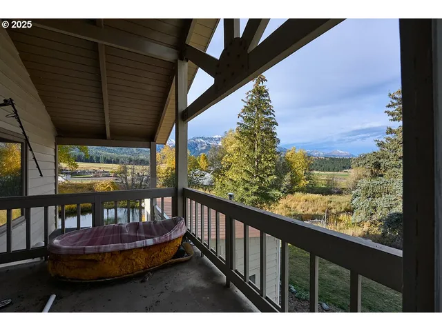 a bathroom with a sink toilet vanity granite tub and shower