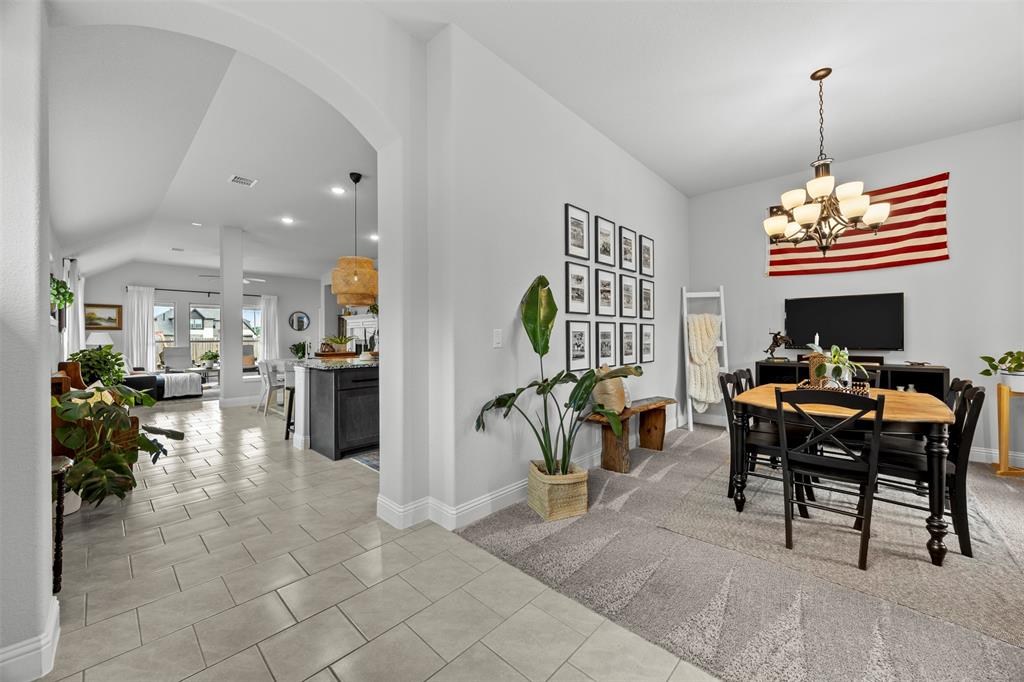 1084 Imperial Eagle Road Alvarado, TX 76009 - Photo 7 of 39 a dining room filled with furniture and a chandelier