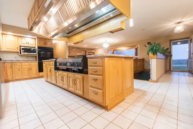 a kitchen with stainless steel appliances a sink and counter top