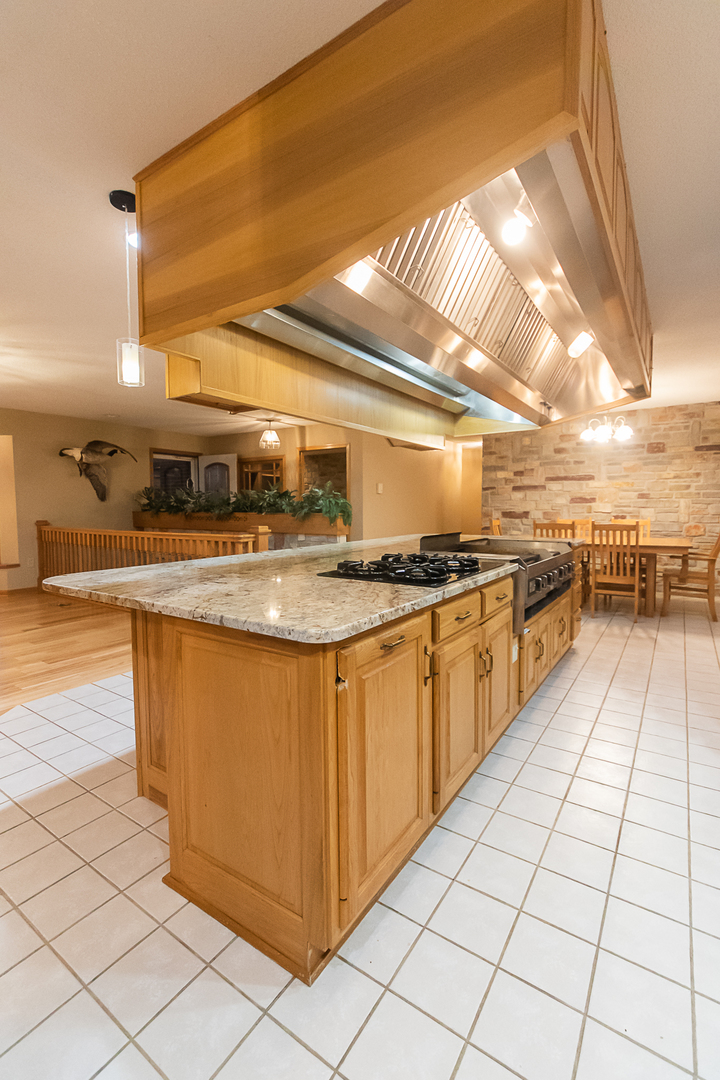 1245 Highway 26 Dixon, IL 61021 - Photo 18 of 40 a kitchen with stainless steel appliances granite countertop a sink stove and cabinets