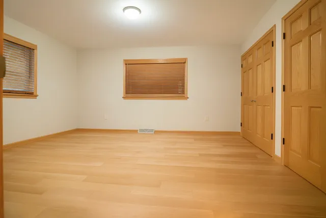 a view of an empty room with a flat screen tv