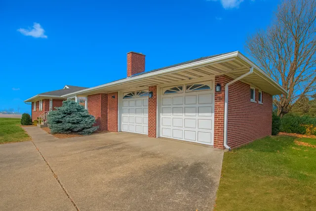 a front view of a house with a garage