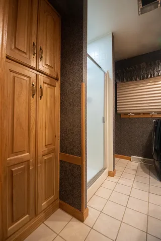 a kitchen with a stove a sink a refrigerator and cabinets