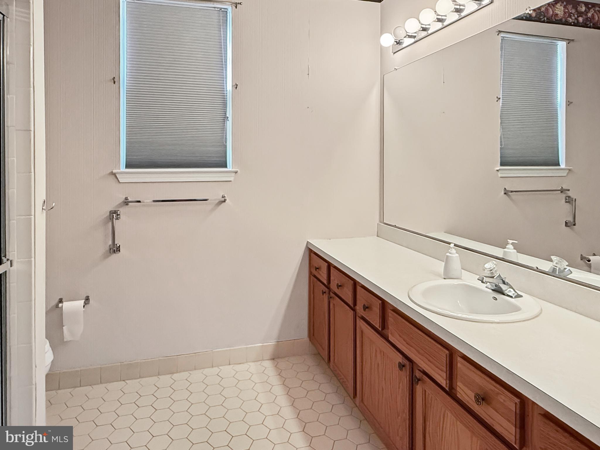 49 Chamber Lane Columbus, NJ 08022 - Photo 13 of 48 a bathroom with a sink and a mirror