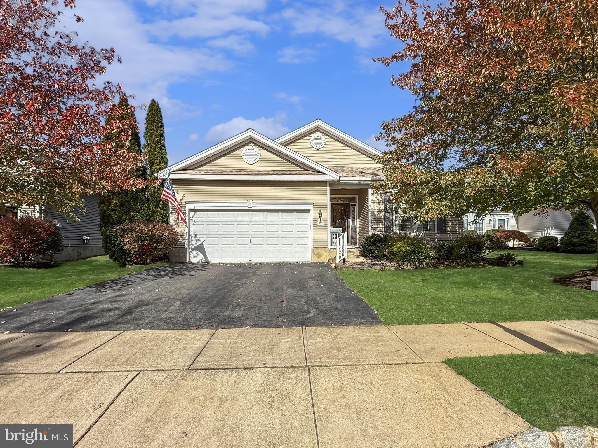 49 Chamber Lane Columbus, NJ 08022 - Photo 15 of 48 a front view of a house with a yard and garage