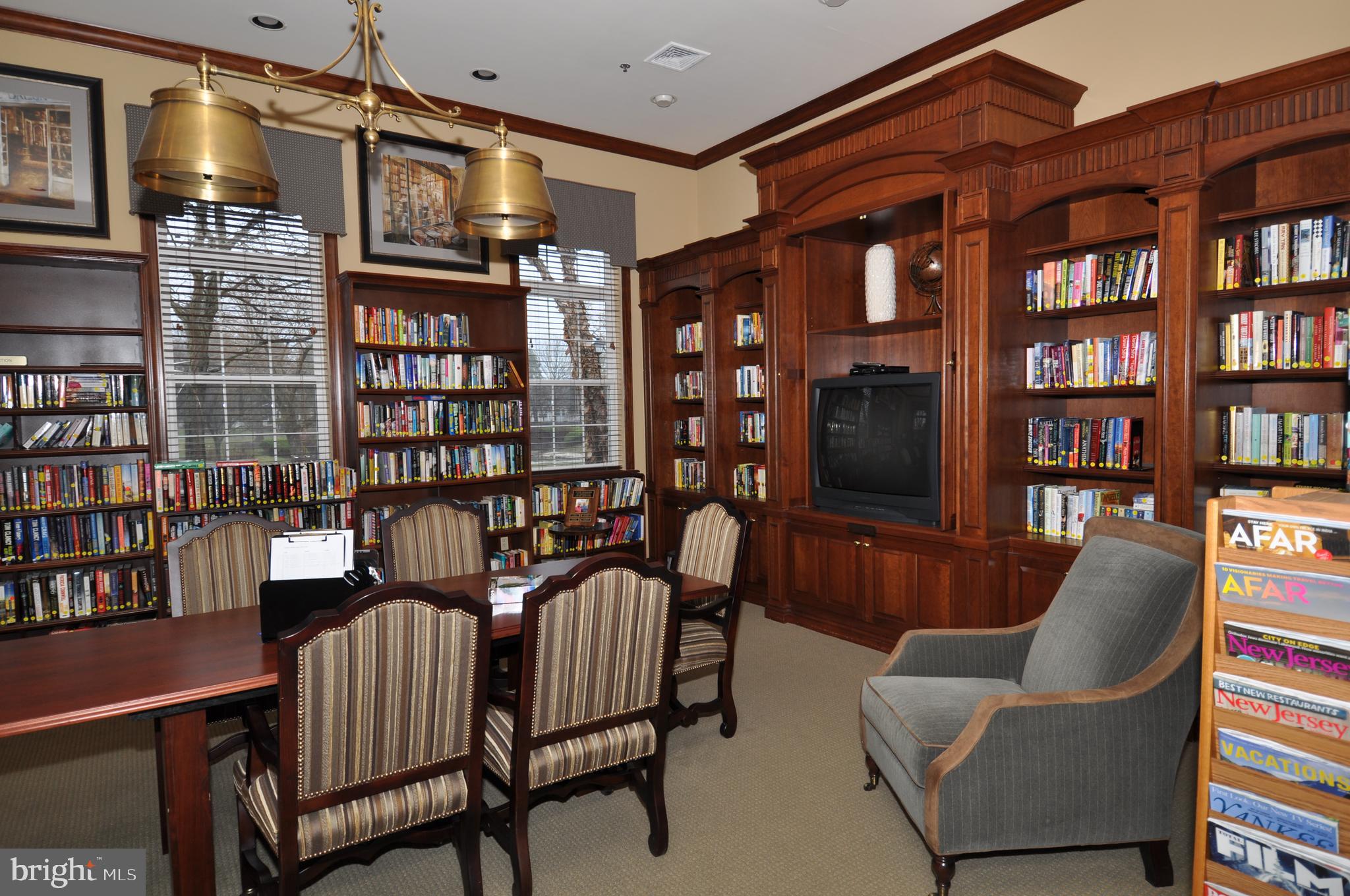 49 Chamber Lane Columbus, NJ 08022 - Photo 28 of 48 a living room with furniture a bookshelf and a book shelf