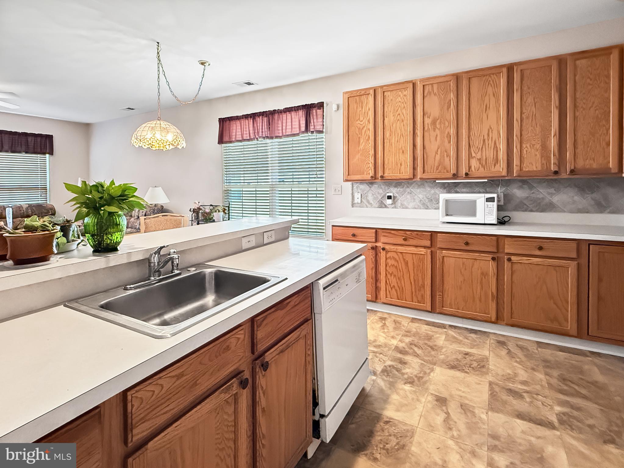 49 Chamber Lane Columbus, NJ 08022 - Photo 3 of 48 a kitchen with stainless steel appliances a sink stove and cabinets