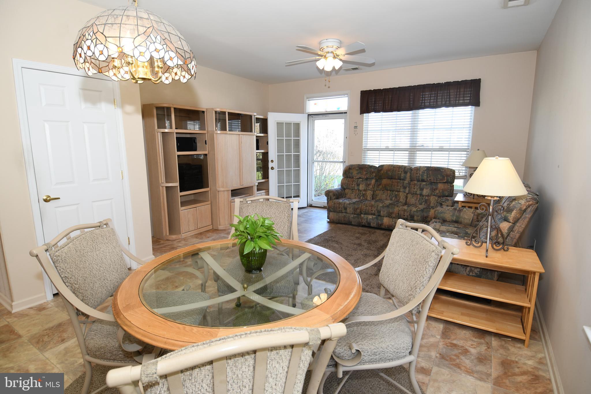 49 Chamber Lane Columbus, NJ 08022 - Photo 40 of 48 a living room with furniture a chandelier and a dining room