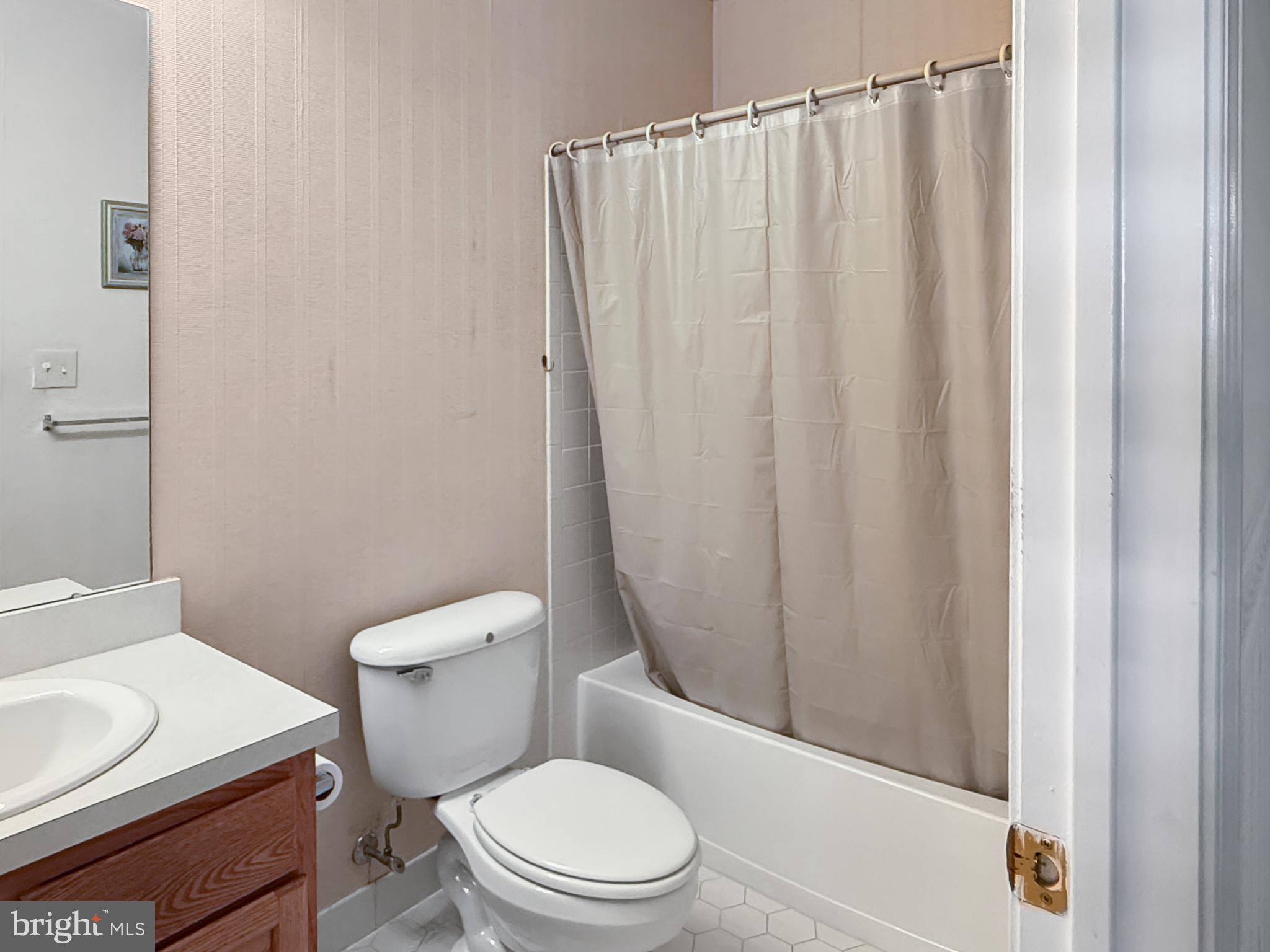 49 Chamber Lane Columbus, NJ 08022 - Photo 9 of 48 a white toilet sitting next to a bathroom sink