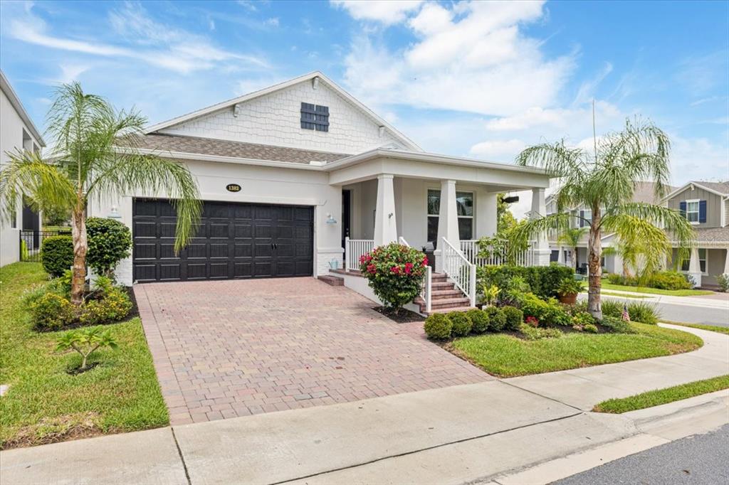 1382 Foltz Loop Oakland, FL 34787 - Photo 1 of 1 a front view of a house with garden