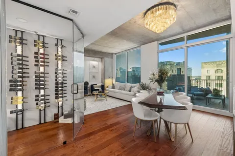 a living room with a couch and a glass door