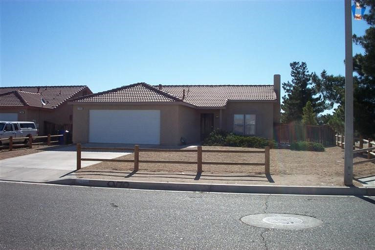 14985 Daisy Road Adelanto, CA 92301 - Photo 1 of 1 a house view with a garden space