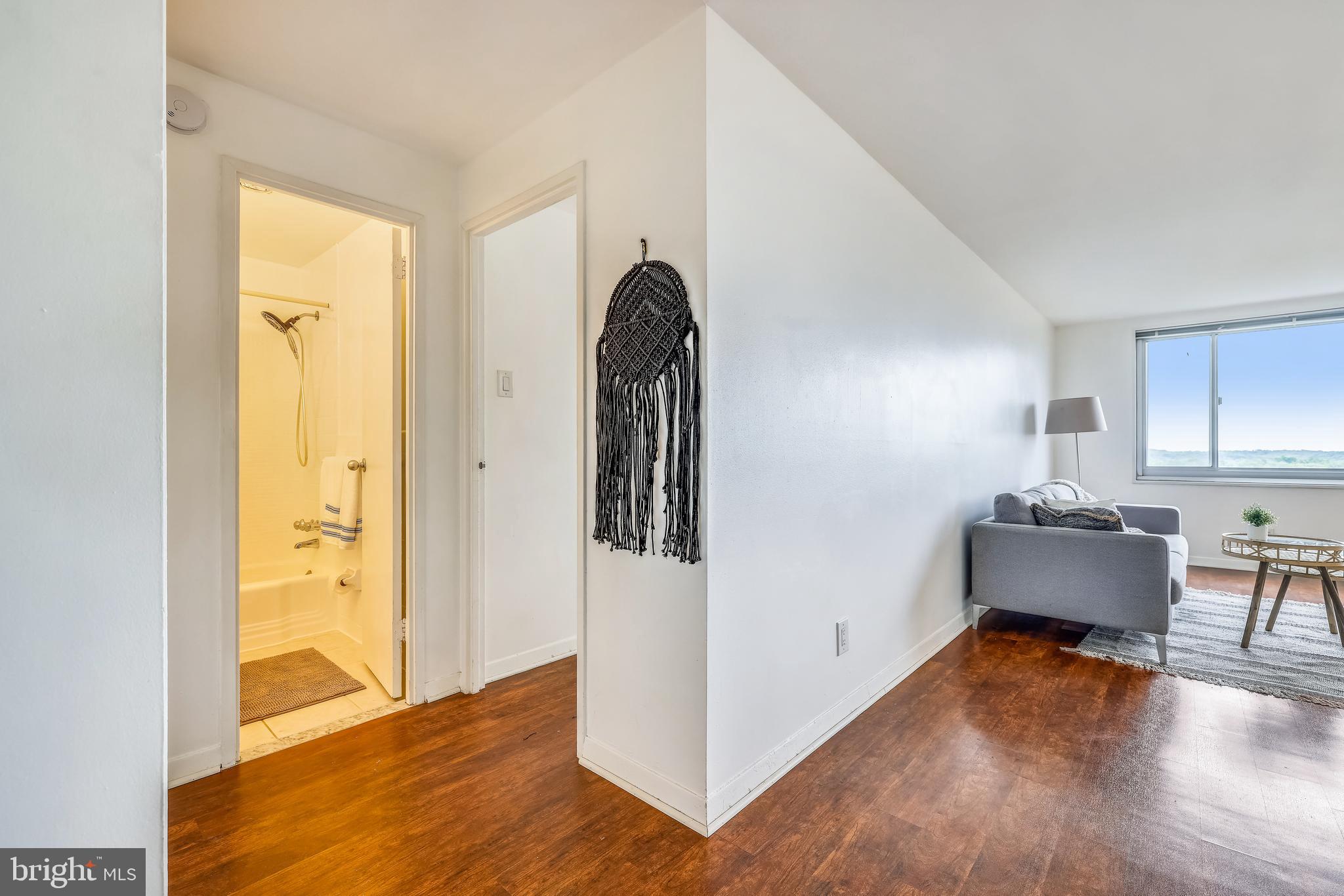 1900 Lyttonsville Road, Unit 1308 Silver Spring, MD 20910 - Photo 10 of 30 a view of a room with wooden floor and furniture