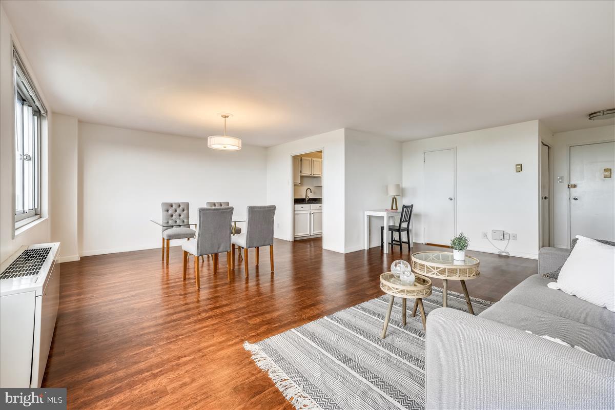 1900 Lyttonsville Road, Unit 1308 Silver Spring, MD 20910 - Photo 28 of 30 a living room with furniture a wooden floor and a rug
