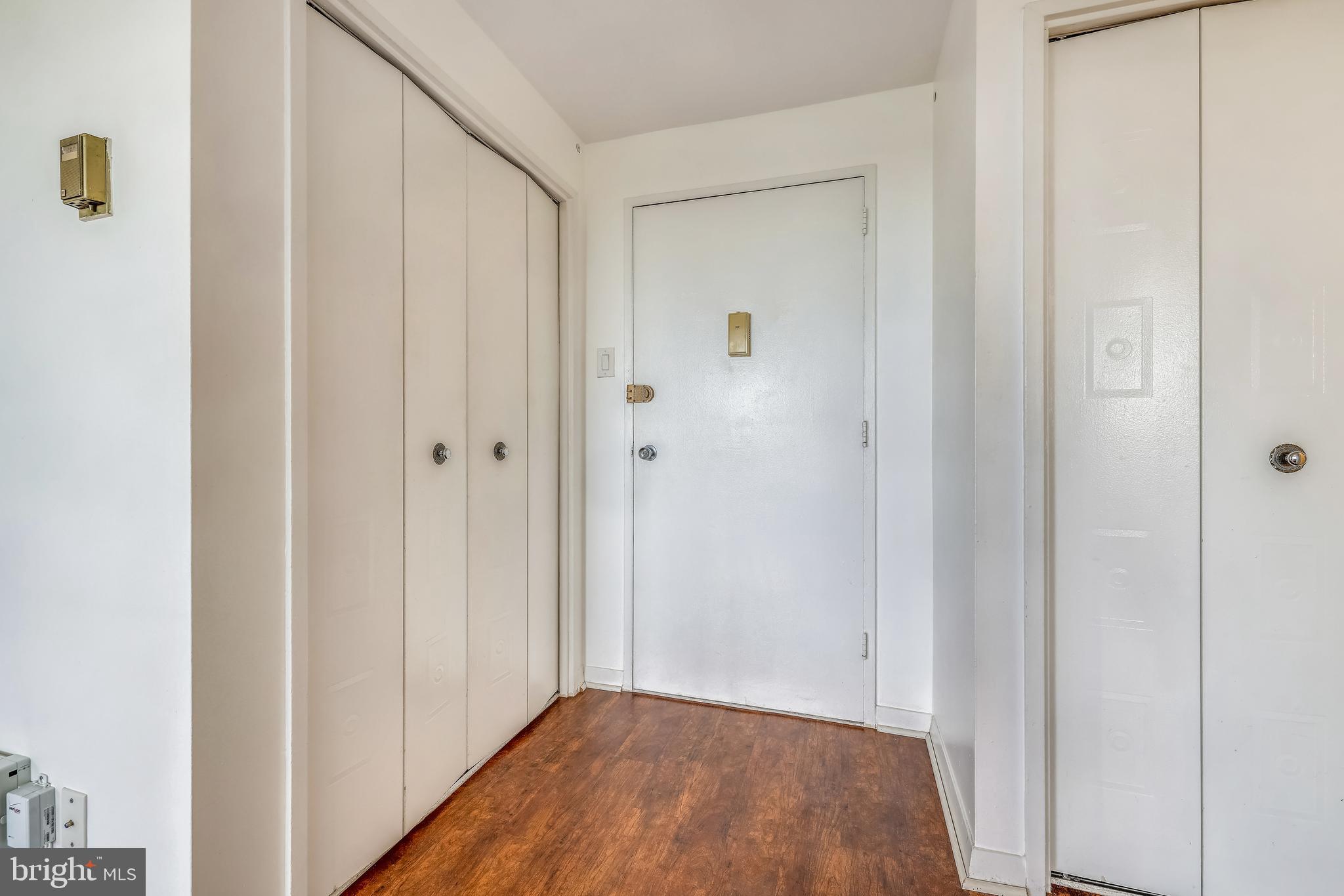 1900 Lyttonsville Road, Unit 1308 Silver Spring, MD 20910 - Photo 4 of 30 a view of a hallway with wooden floor