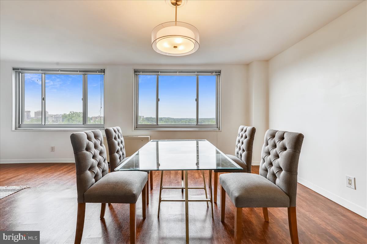 1900 Lyttonsville Road, Unit 1308 Silver Spring, MD 20910 - Photo 6 of 30 a view of a dining room with furniture and window