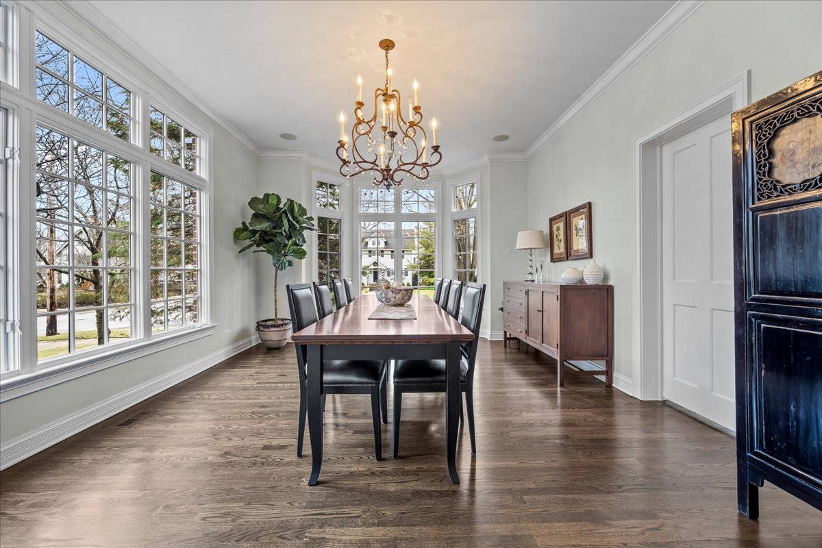 410 Cedar Street Winnetka, IL 60093 - Photo 11 of 57 a view of a dining room with furniture window and wooden floor