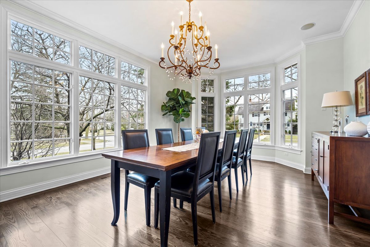410 Cedar Street Winnetka, IL 60093 - Photo 12 of 57 a view of a dining room with furniture window and wooden floor