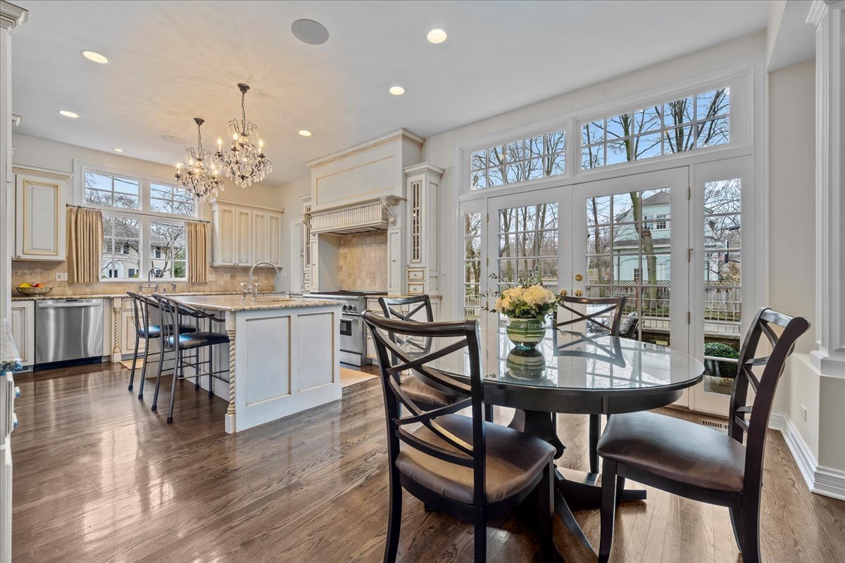 410 Cedar Street Winnetka, IL 60093 - Photo 15 of 57 a view of a dining room with furniture window and wooden floor