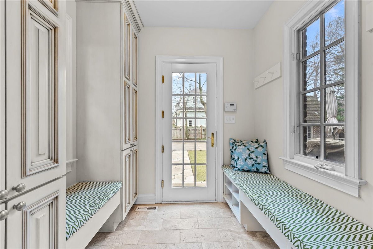 410 Cedar Street Winnetka, IL 60093 - Photo 20 of 57 a spacious bedroom with a large bed and a large window